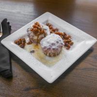 Bread Pudding · Traditional bread soaked in an amaretto custard and baked to perfection. Served with house-m...