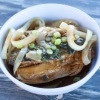 Bistek Bangus Belly · Boneless bangus milkfish belly simmered with lemon soy sauce topped with fried onions.