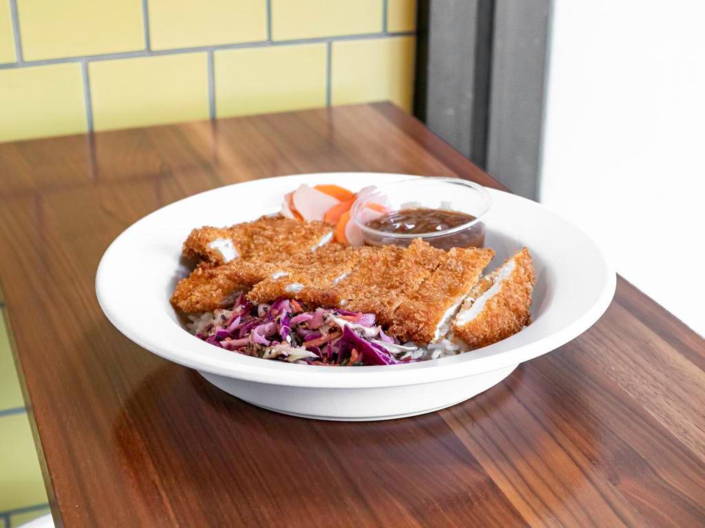 Chicken Katsu Curry Bowl · Chicken breast breaded with our house spice blend and panko then fried to perfection. Served over chicken rice with sesame slaw, fukujinzuke, and our house-made curry sauce.