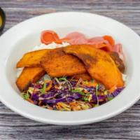 Vegetarian Curry Bowl · Fried porcini dusted sweet potato. Served over chicken rice with sesame slaw, fukujinzuke, a...