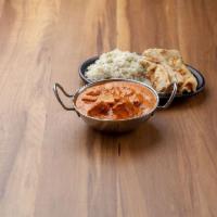 Chicken Tika Masala · Pieces of marinated chicken grilled and sauteed in aromatic masala. Served with rice and rai...