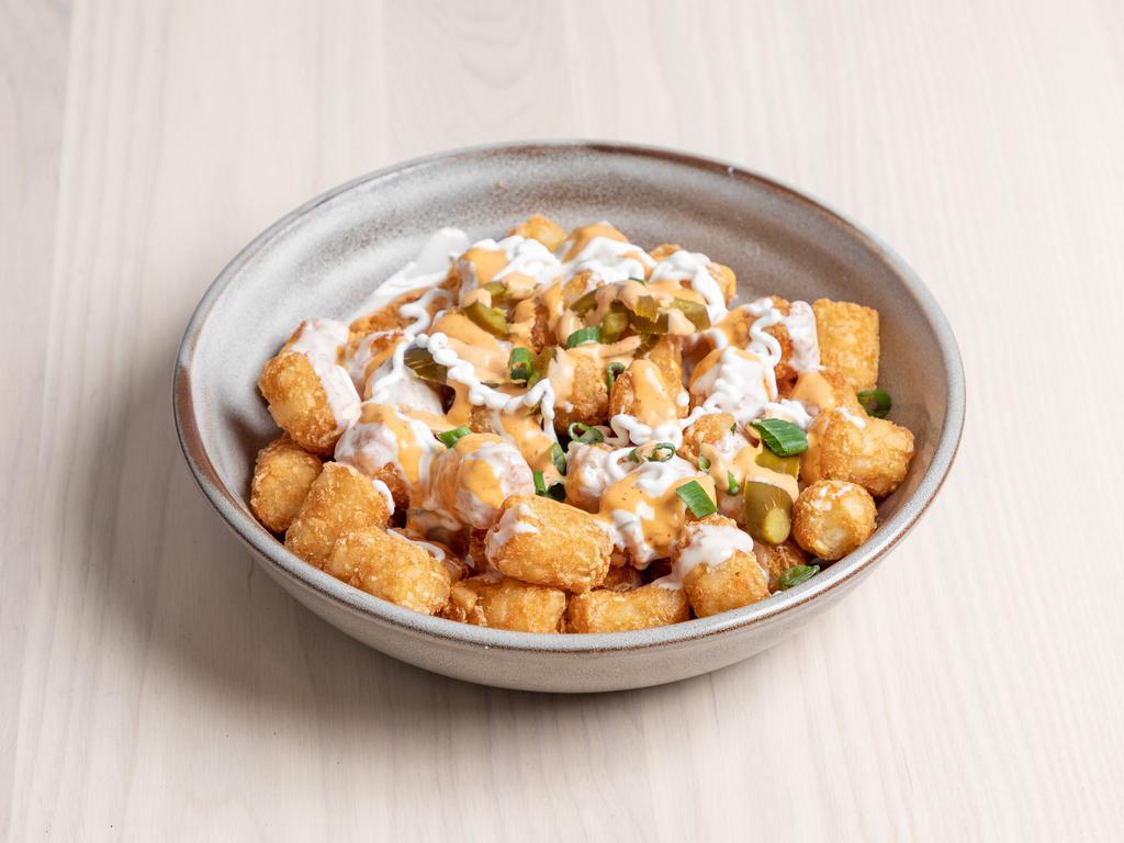 Totchos · Queso, jalapenos, sour cream, chipotle, mayo and green onion. Add bacon, chili, guacamole for an extra charge.