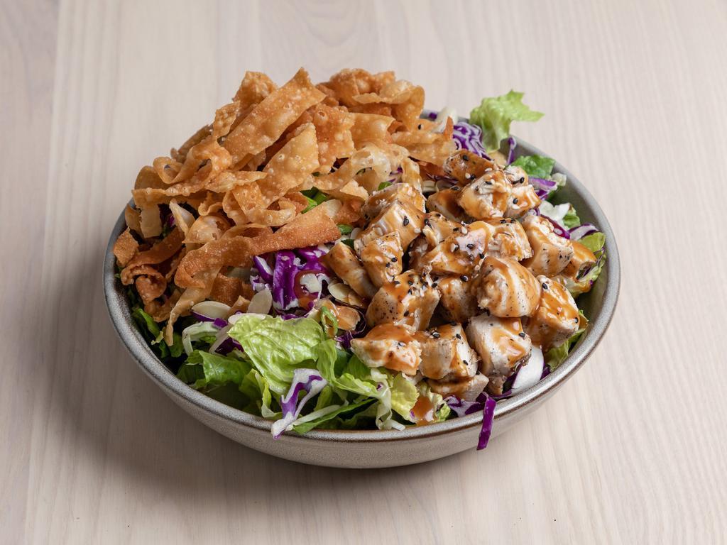 Asian Ginger Salad · Kale and cabbage mix, toasted almonds, green onion, fried wontons, sesame seeds, ginger dressing.