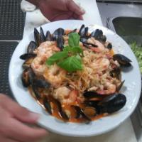Seafood Pescatore · Clams, Scallops, Mussels, Shrimp & Crab with a Wine Garlic sauce over Linguini. Including a ...