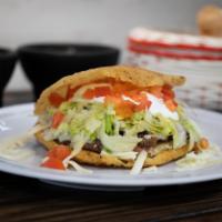 Gordita · Contains lettuce, tomato, cheese and sour cream, with choice of meat.