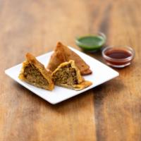 2 Keema Samosa · Triangular pastry with mildly spiced minced lamb and garam masala. Contains gluten.