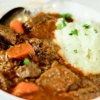 Goulash · Served with mashed potatoes.