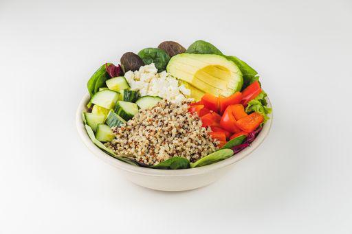 Quinoa Feta Avocado Grain Bowl · Tri-color quinoa, organic mixed greens, avocado, English cucumbers, red bell peppers and feta cheese with green goddess dressing. Vegetarian and gluten-free.