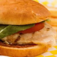 Grilled Chicken Sandwich · Marinated chicken breast. Served with mayonnaise, lettuce, tomato and pickles. 