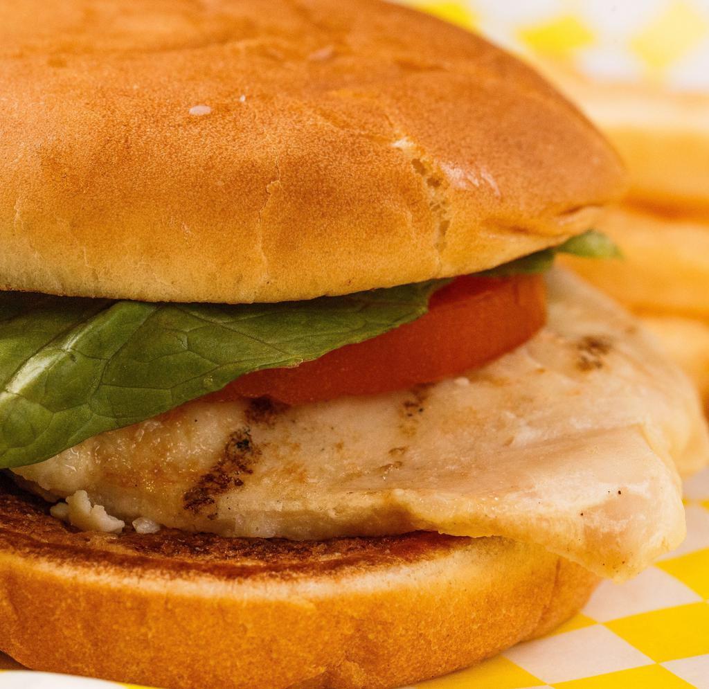 Grilled Chicken Sandwich · Marinated chicken breast. Served with mayonnaise, lettuce, tomato and pickles. 