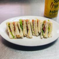 Turkey Club Sandwich · Oven roasted turkey, smoked bacon, lettuce, tomato, American cheese on choice of white or wh...