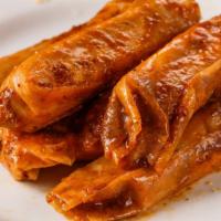 1/2 Dozen Tamales · Seasoned ground beef roll in corn meal. Marinated and cooked in tamale sauce. 