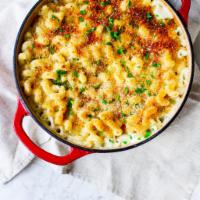 Basic Mac · Elbow pasta in a creamy sauce with a blend of French Raclette, American aged Cheddar, and re...