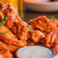 Wings · 1 lb of crisp golden-brown wings tossed in two sauces of your choice