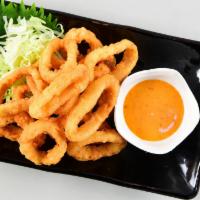 Fried Calamari · Deep-fried golden brown calamari served with spicy mayo sauce.