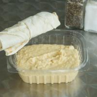Hummus Homemade · Served with a side of pita bread chickpeas blended with lemon juice, oil oil and herbs.