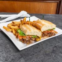 Exchange Steak and Cheese Sandwich · Served with french fries. Thinly sliced sirloin with American cheese, peppers, onions, lettu...