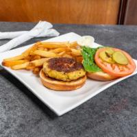 Crab Cake Sandwich · Broiled lump crabcake sandwich on a brioche roll served with lettuce, tomato, onion tartar s...