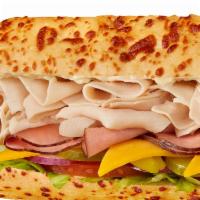 #26 Turkey, Ham & Cheddar Sandwich · 1/4 lb. combination of premium meats with mayo. Served Togo's style (lettuce, tomatoes, onio...