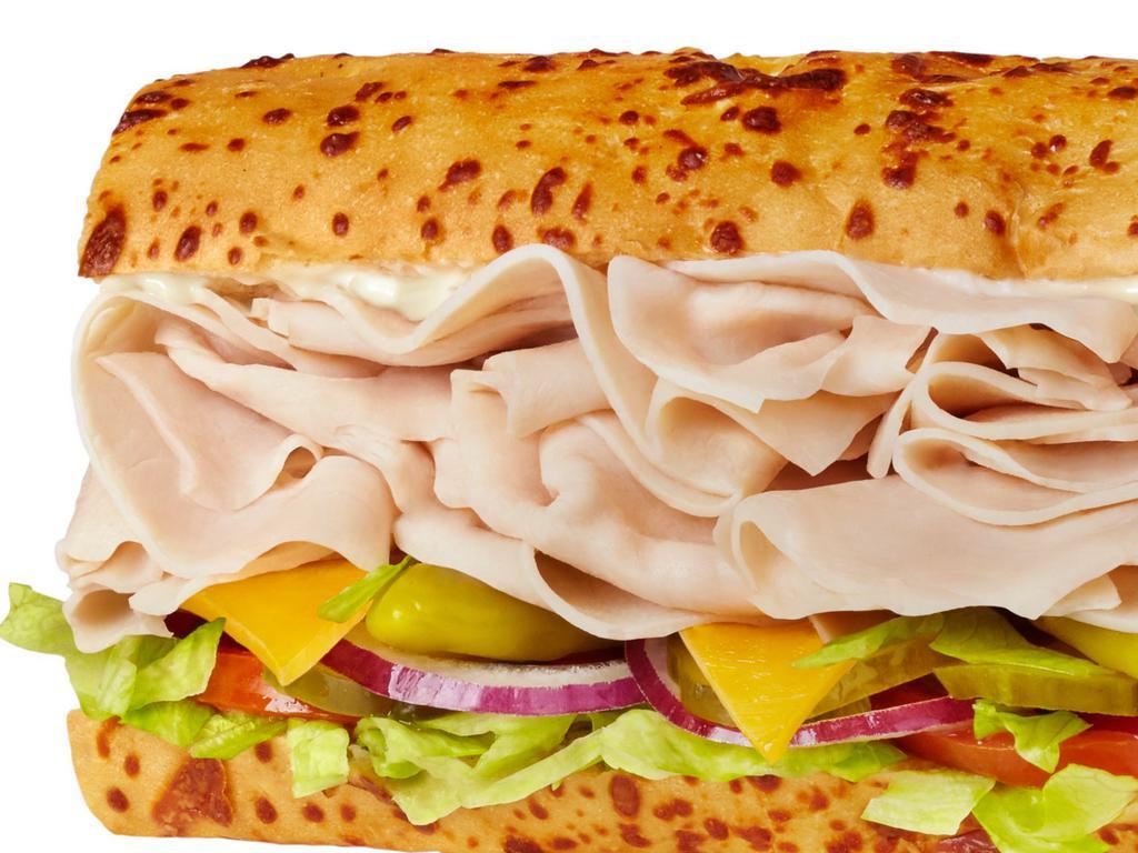 #3 Turkey & Cheddar Sandwich · 1/4 lb. of turkey and cheddar cheese with mayo. Served Togo's style (lettuce, tomatoes, onions, pickles, and pepperoncinis).