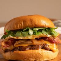 Breakfast Burger · Cheddar cheese/ american cheese over medium egg, ground angus beef, cheese arugula, grilled ...