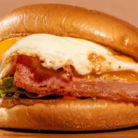The B.E.C · Cheddar cheese/ american cheese thick cut bacon, over medium egg, cheese, ketchup mayo, warm...