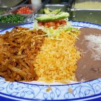 Tinga de Pollo · Chicken, onions and chipotle sauce with rice, beans, and tortillas. Corn tortilla.