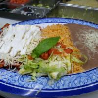Steak Enchilada · Comes with rice, 
beans, and sour cream.