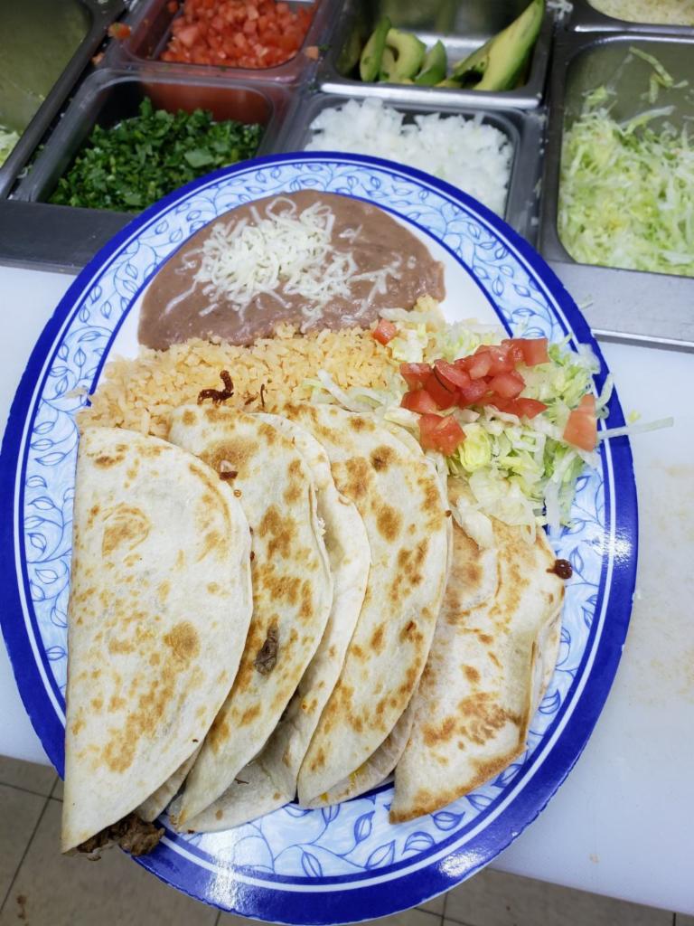Quesadillas Dinner  · Made with flour tortillas, guacamole,
sour cream and garnish.