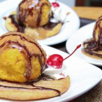 Fried Ice Cream · A hand-crafted ball of vanilla ice cream, rolled in a flacky mix and fried (yes, its fried) ...