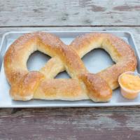 Bigg's Homemade Giant Pretzel · Served with cheddar cheese or spicy con queso cheese.