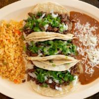 Taco Dinner · 3 tacos with your choice of meat, served with rice and beans and topped with onion and cilan...