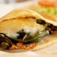 Rajas con Queso Gordita · Sliced poblano pepper with melted chihuahua cheese.