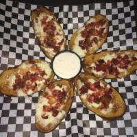 Potato Skins · 6 Potato Skins with Real Bacon and Cheese. Served with Ranch Dipping Sauce or Sour Cream.