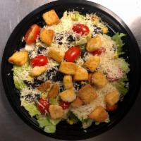 Southwest Caesar Salad · Fresh, Crisp Romaine Lettuce, Sweet Corn, Black Olives, Fresh Tomatoes, Parmesan Cheese and ...