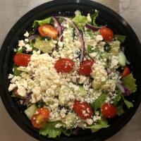 Greek Salad · Fresh, Crisp Romaine Lettuce, Sliced Onions, Black Olives, Cucumbers, Fresh Tomatoes and Fet...