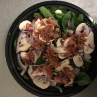 Spinach Salad · Baby Spinach, Sliced Mushrooms, Sliced Onions and Real Bacon. Served with Balsamic Vinaigret...