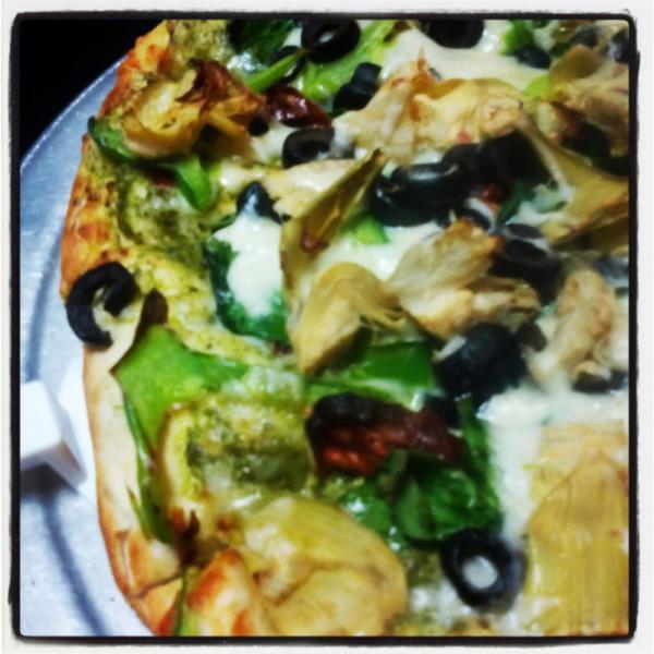 #18 Pesto Vegetarian · Zesty Pesto Sauce, Spinach, Sun-Dried Tomatoes, Black Olives, Bell Peppers and Artichoke Hearts.