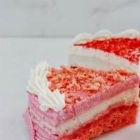 Strawberry Cheesecake Cake Slice · Vegan strawberry cake with a top layer of cheesecake.