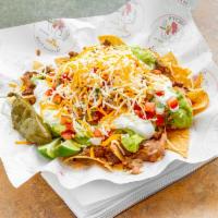 Nachos Supreme Online · Warm chips, carne asada, beans, pico de gallo, guacamole, sour cream and cheese.