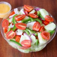 Garden Salad · Iceberg lettuce, cucumbers, carrots, green peppers and cherry tomatoes with Italian dressing.