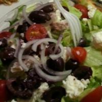 Greek Salad · Iceberg lettuce, red onions, Kalamata olives, cherry tomatoes and feta cheese with Caesar dr...