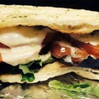 Turkey Sandwich · Sliced turkey, lettuce, tomato, melted provolone cheese, mustard and mayo.