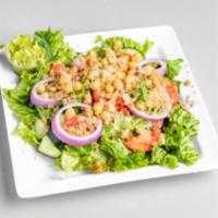 Dollies House Salad  · Crispy green leaf lettuce and baby spinach mix with Roma tomatoes, cucumbers, red onion, car...