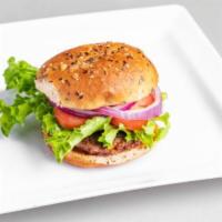 Classic Burger · Quarter pound burger that's pan-fried to perfection, topped with crispy green leaf lettuce, ...