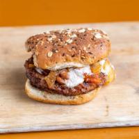 Chili Cheese Burger · Quarter pound burger that's pan-fried to perfection, topped with chili, Dollie's vegan chees...