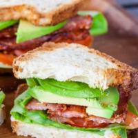 ABLT Sandwich Deluxe · Avocado, bacon, lettuce, tomatoes, french fries, and pickle.