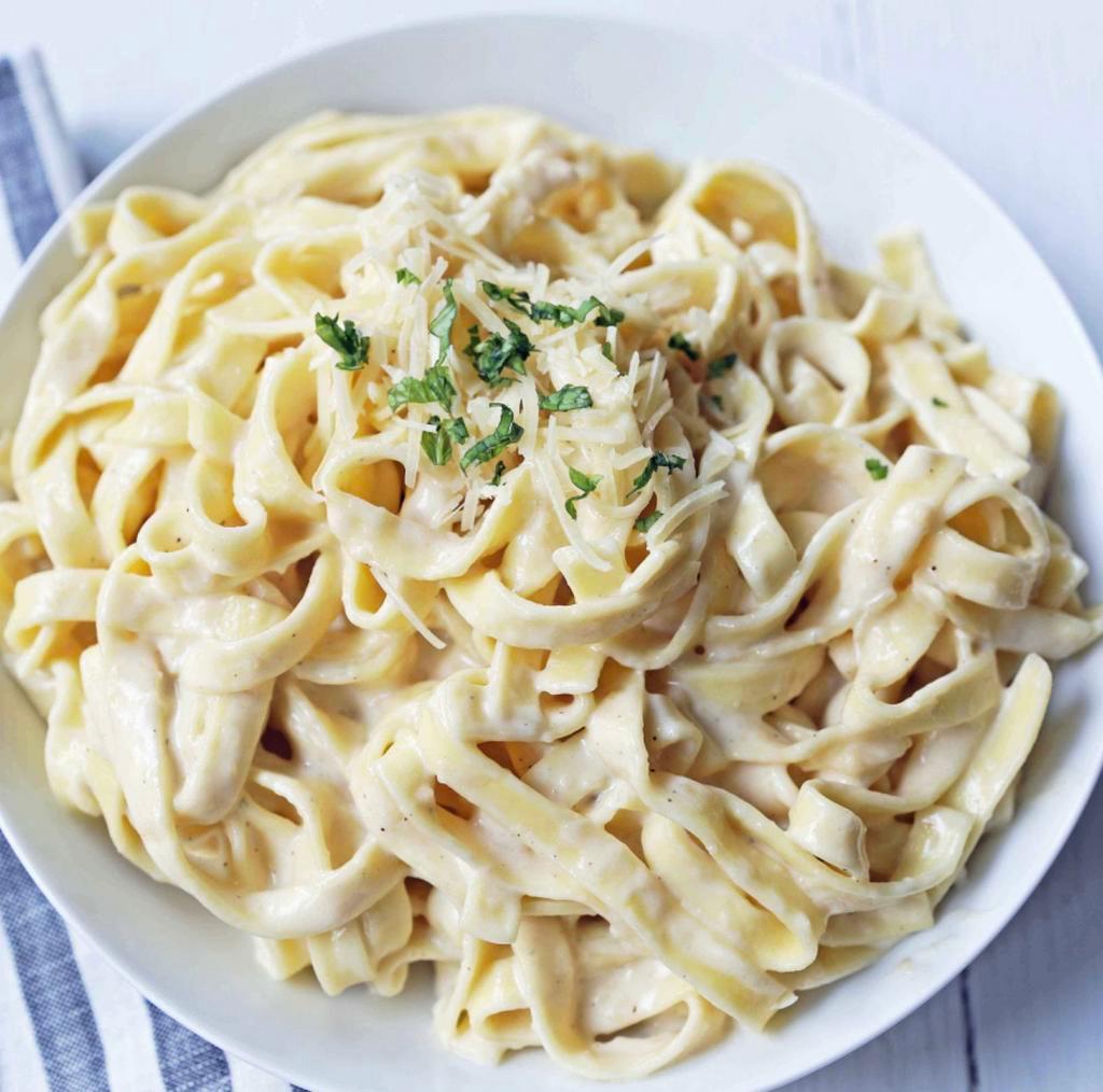 Fettuccine Alfredo · Served with salad, bread and butter and Romano cheese.