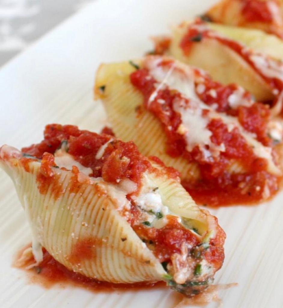 Stuffed Shells · Served with salad, bread and butter and Romano cheese.