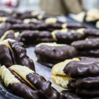 Assorted Filled Cookie *NO NUTS* · Assortment of chocolate dipped sandwich butter cookies without nuts.
*Fillings will vary*